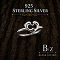 925 Sterling Silver Open Heart Infinity Ring on bark background