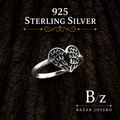 925 Sterling Silver Angel Wings Heart Ring on bark background