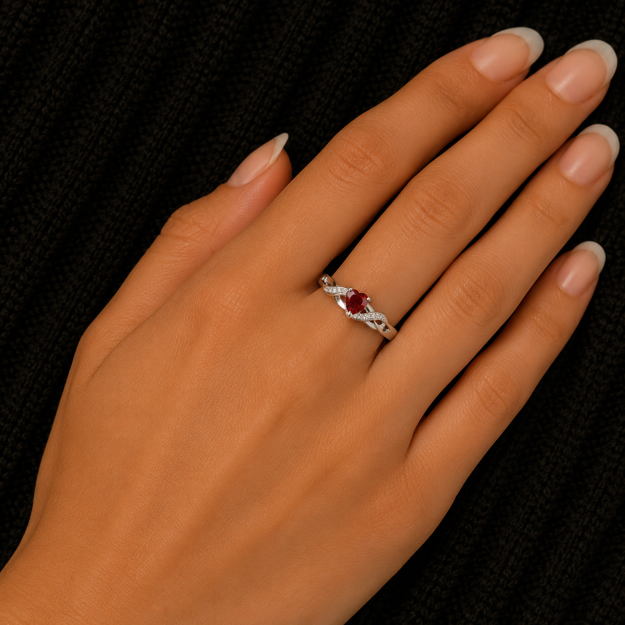 925 Sterling Silver Heart Garnet CZ Ring worn on woman's hand