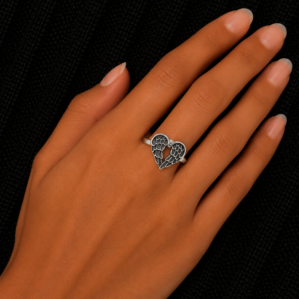 925 Sterling Silver Angel Wings Heart Ring worn on woman's hand