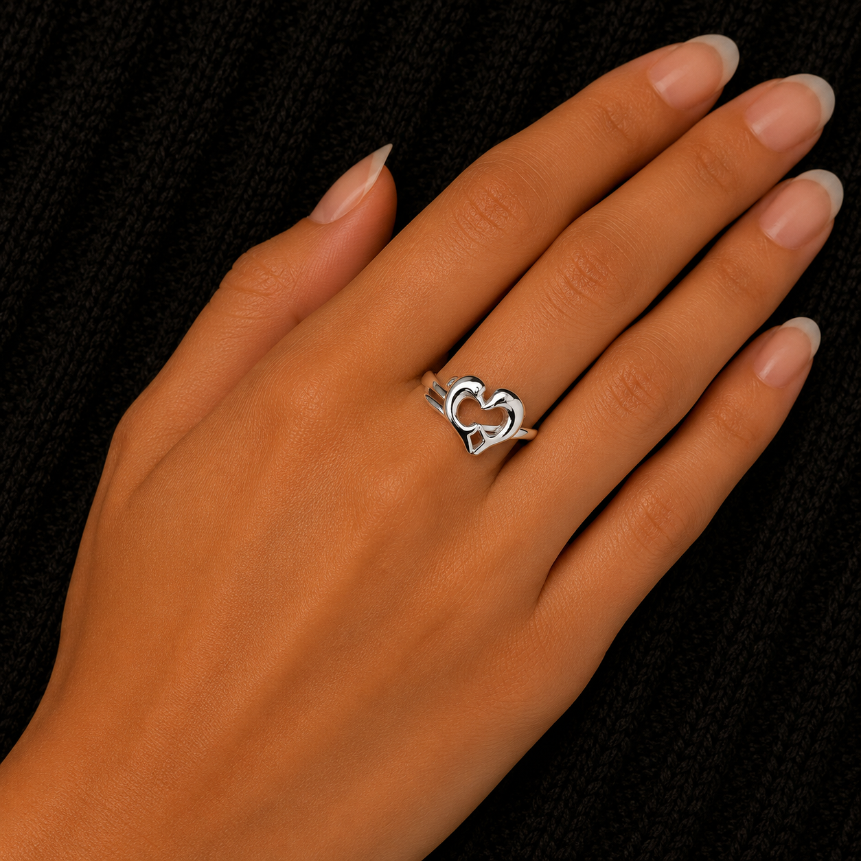 925 Sterling Silver Open Heart Infinity Ring worn on woman's hand
