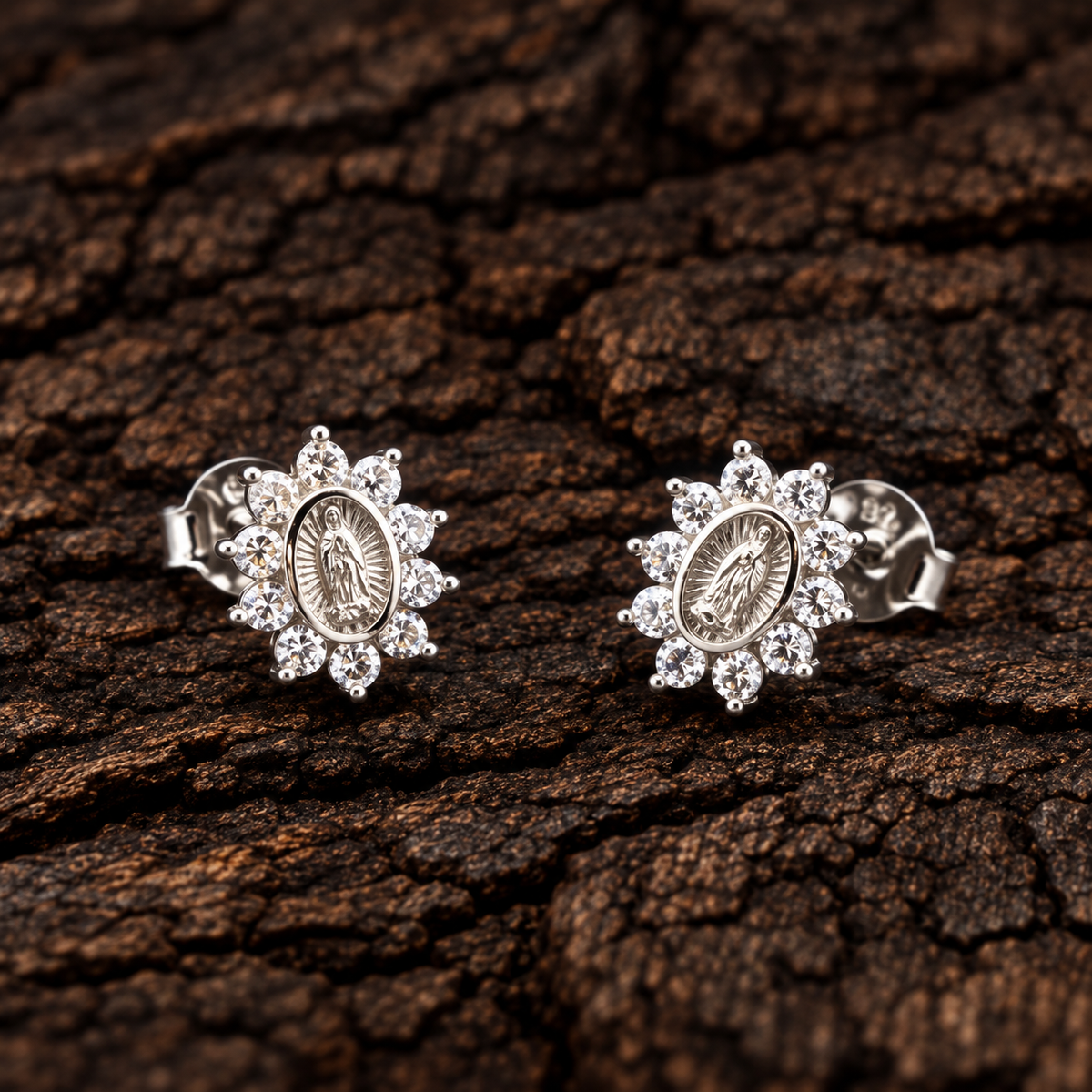 Virgin Mary 925 sterling silver stud earrings surrounded by sparkling cubic zirconia.