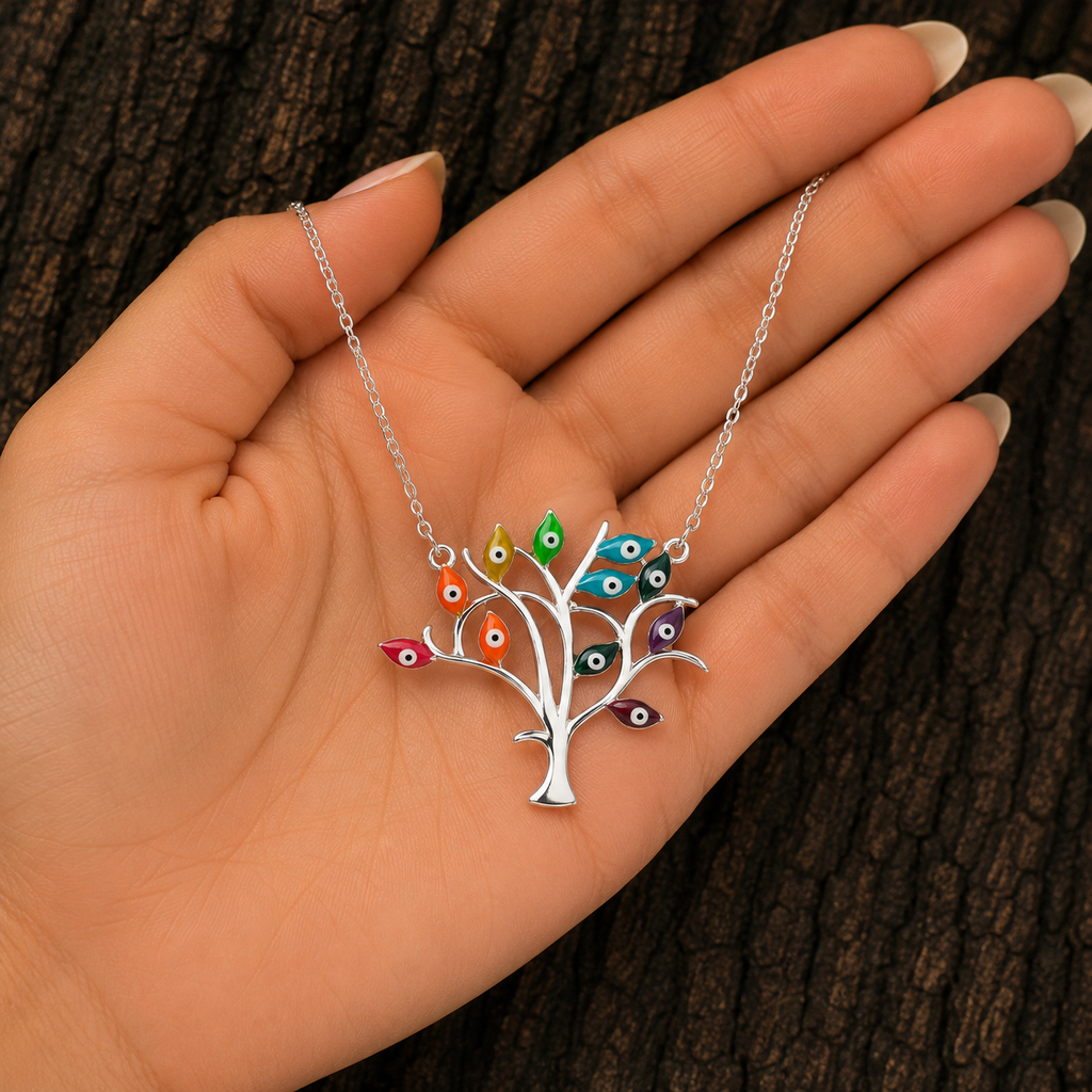 Multicolor Evil Eye Tree Necklace shown in hand for size reference