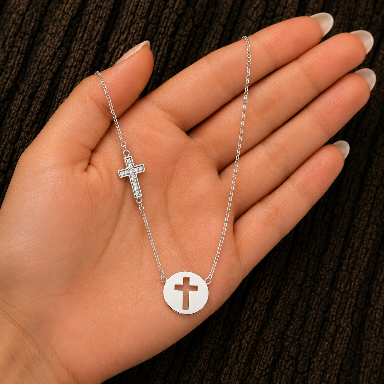 Sterling Silver Cross Necklace shown in hand for size reference