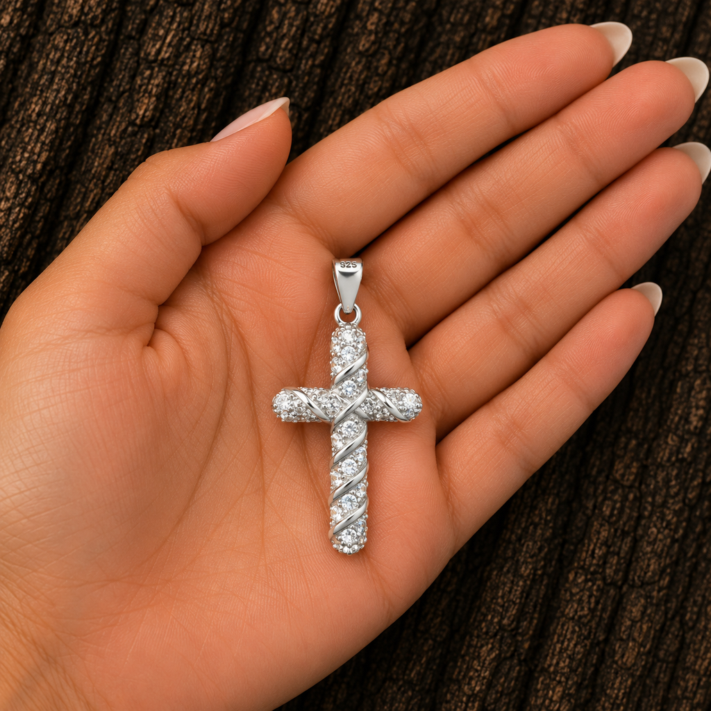 925 Sterling Silver CZ Cross Pendant shown in hand for size reference