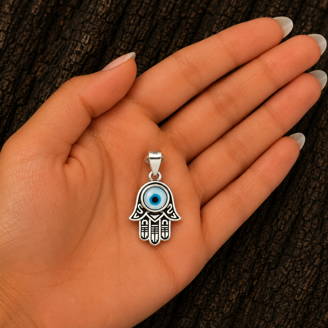 Woman holding 925 Sterling Silver Hamsa Hand Evil Eye Pendant