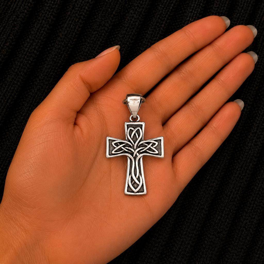 925 Sterling Silver Celtic Cross Pendant shown in hand for size reference