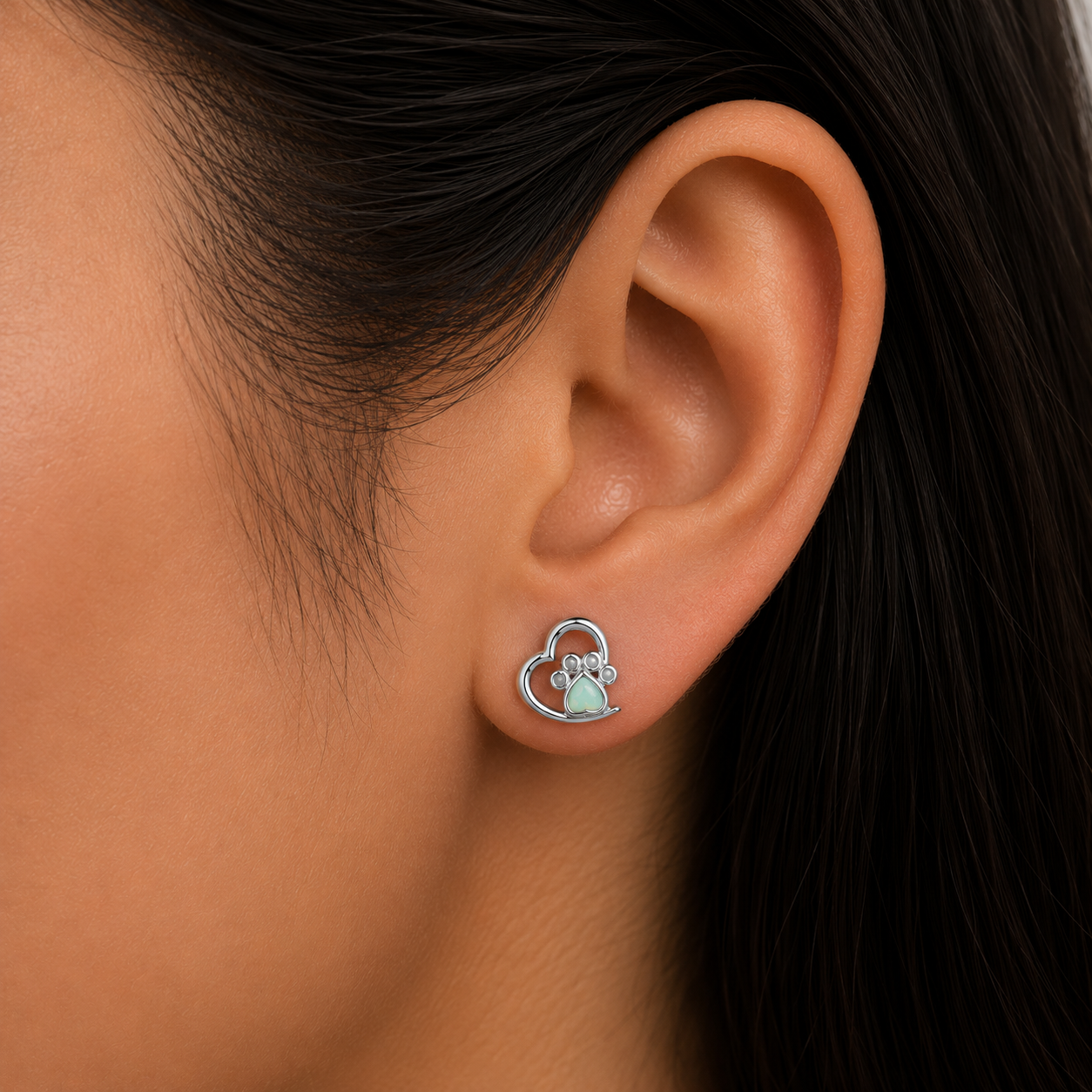 Woman wearing 925 Sterling Silver Heart Paw Print Stud Earrings