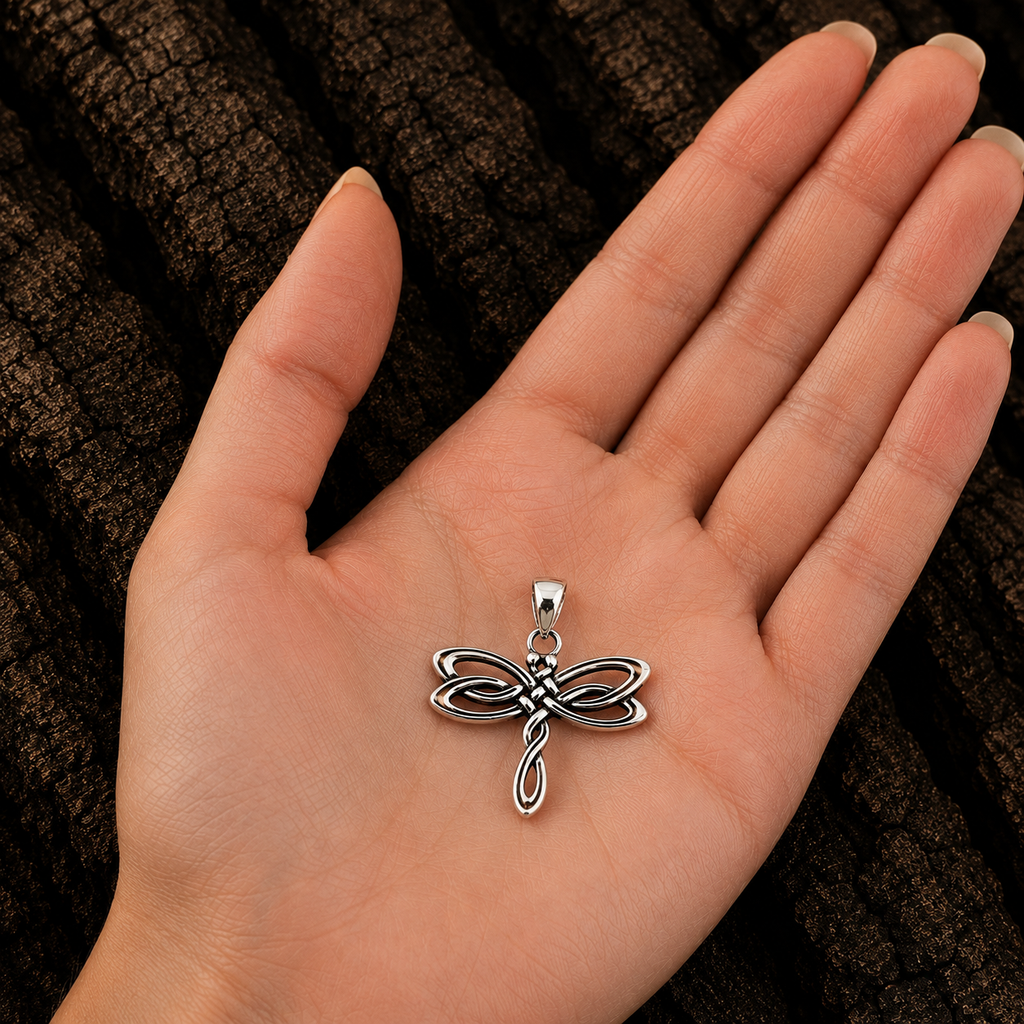 925 Sterling Silver Celtic Dragonfly Pendant shown in hand for size reference