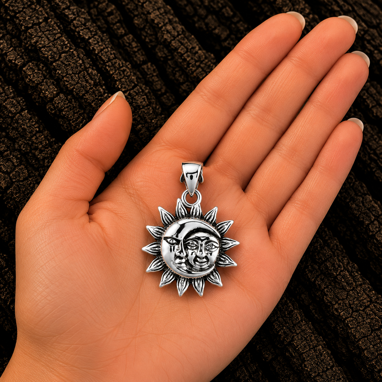 925 Sterling Silver Sun and Moon Pendant shown in hand for size reference