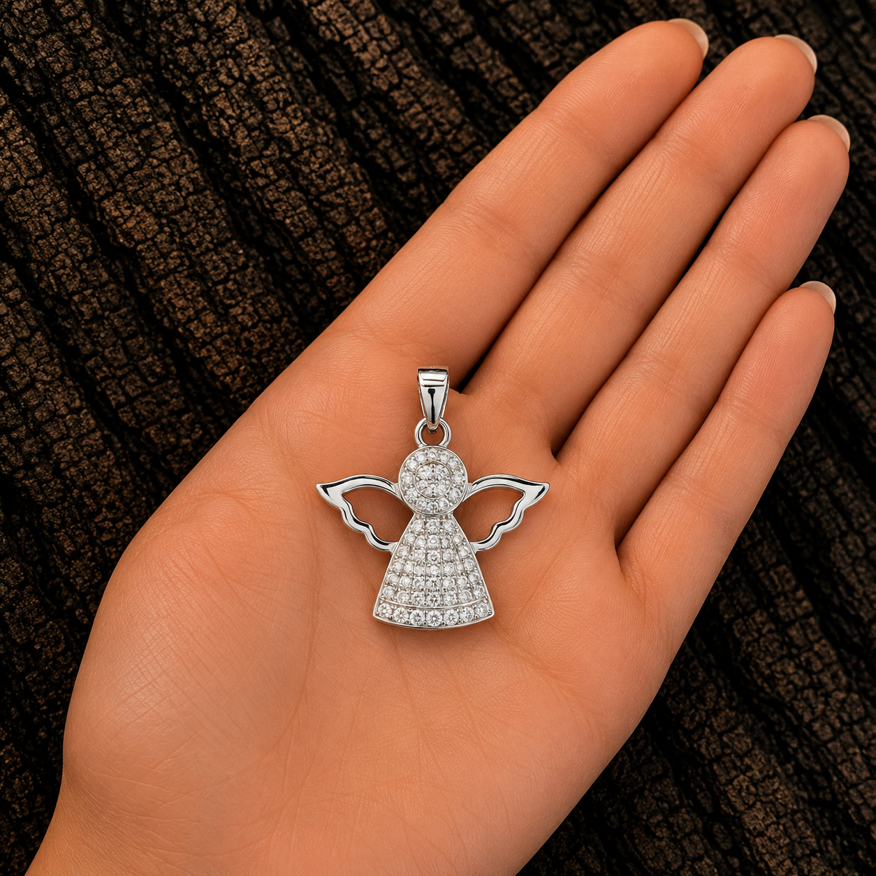 925 Sterling Silver Angel Pendant shown in hand for size reference