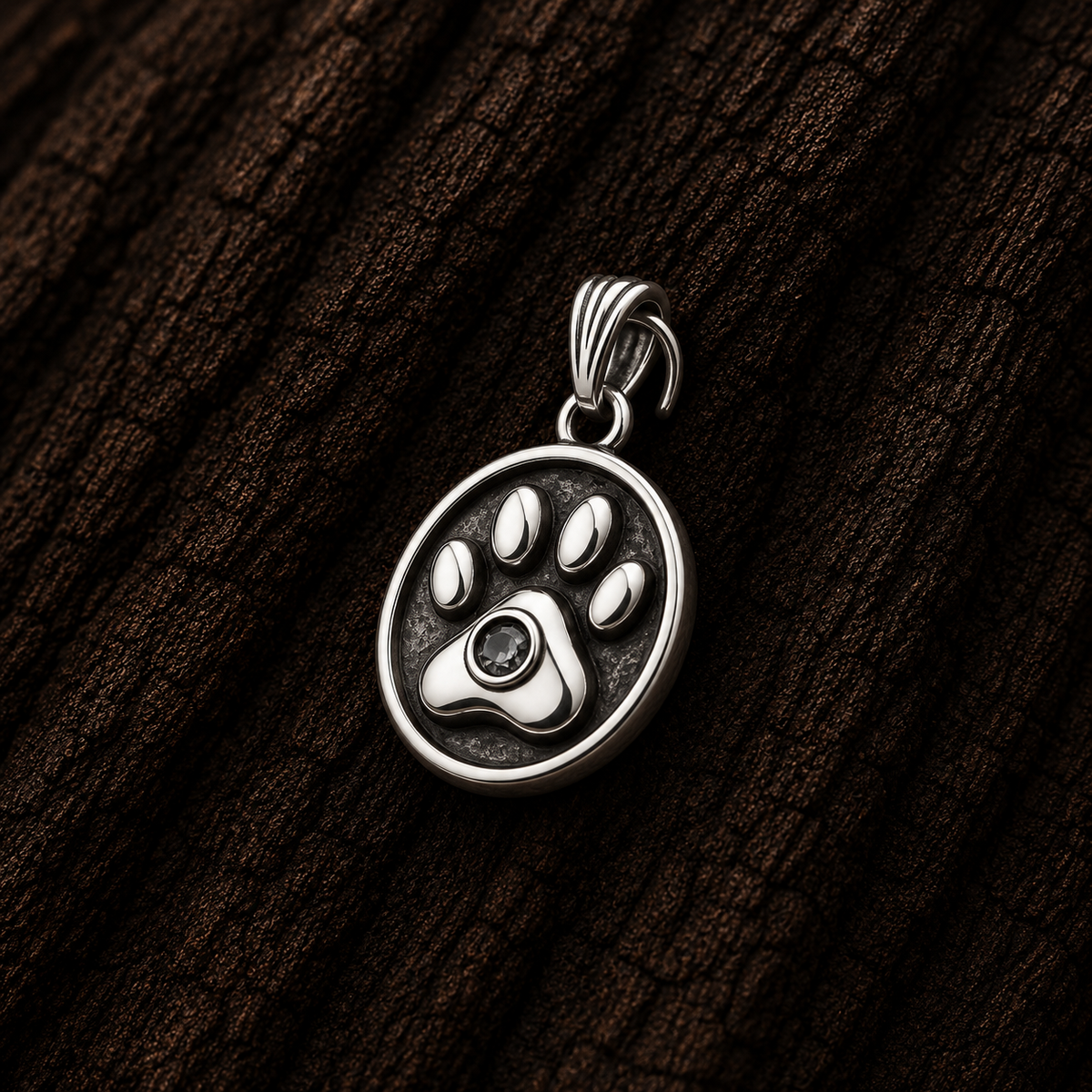 Close-up of 925 Sterling Silver Paw Print Pendant with Cubic Zirconia