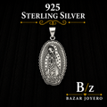 Our Lady of Guadalupe pendant with detailed engraved artwork, crafted in 925 sterling silver and displayed against a dark elegant background.