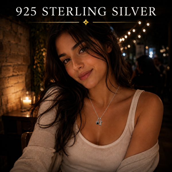 Woman wearing 925 Sterling Silver Paw Print and Bone Necklace with Blue Heart Cubic Zirconia